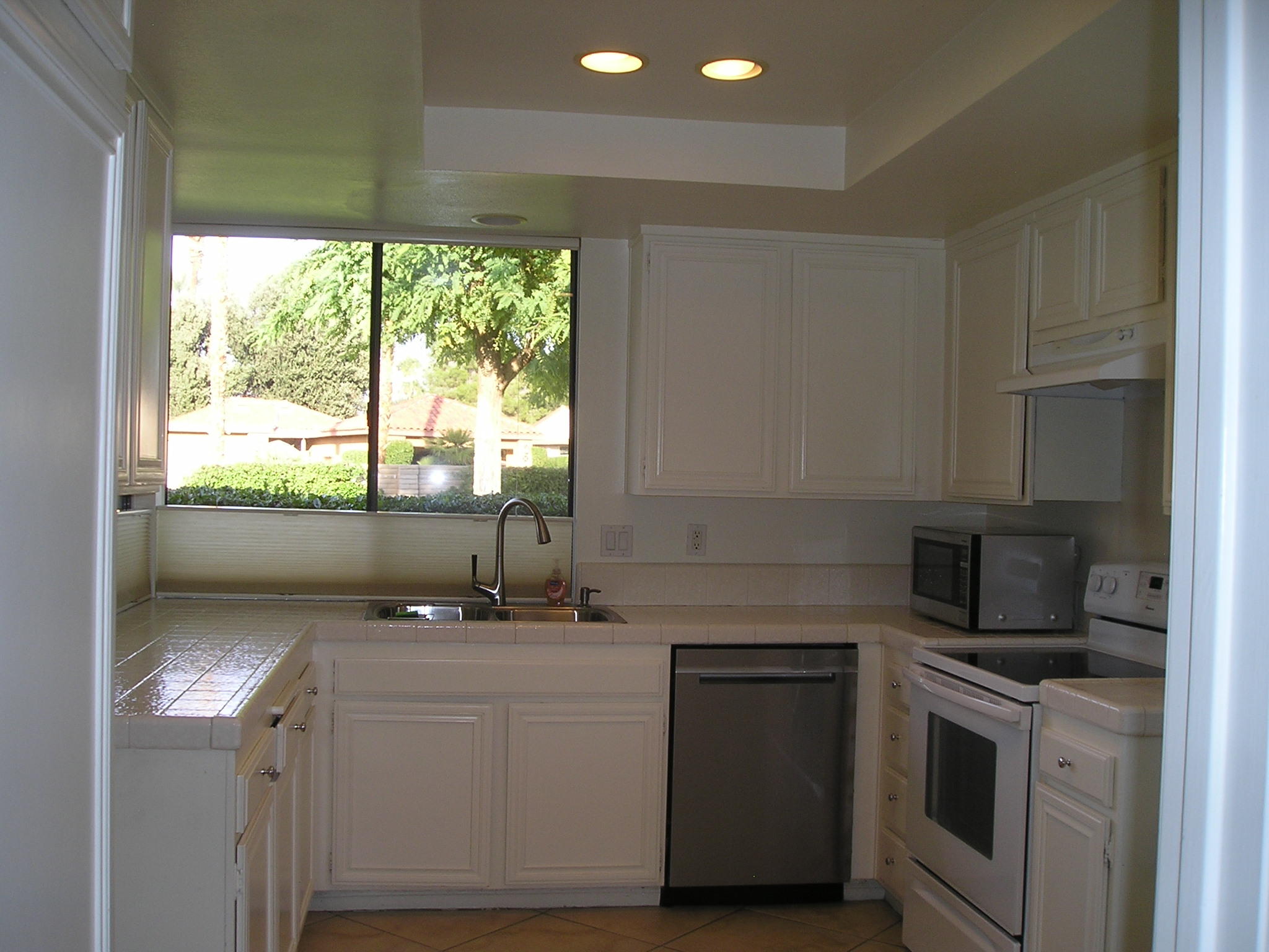 38 Malaga Drive Rancho Mirage, CA 92270 - Photo 7 of 37 a kitchen with a sink cabinets and window
