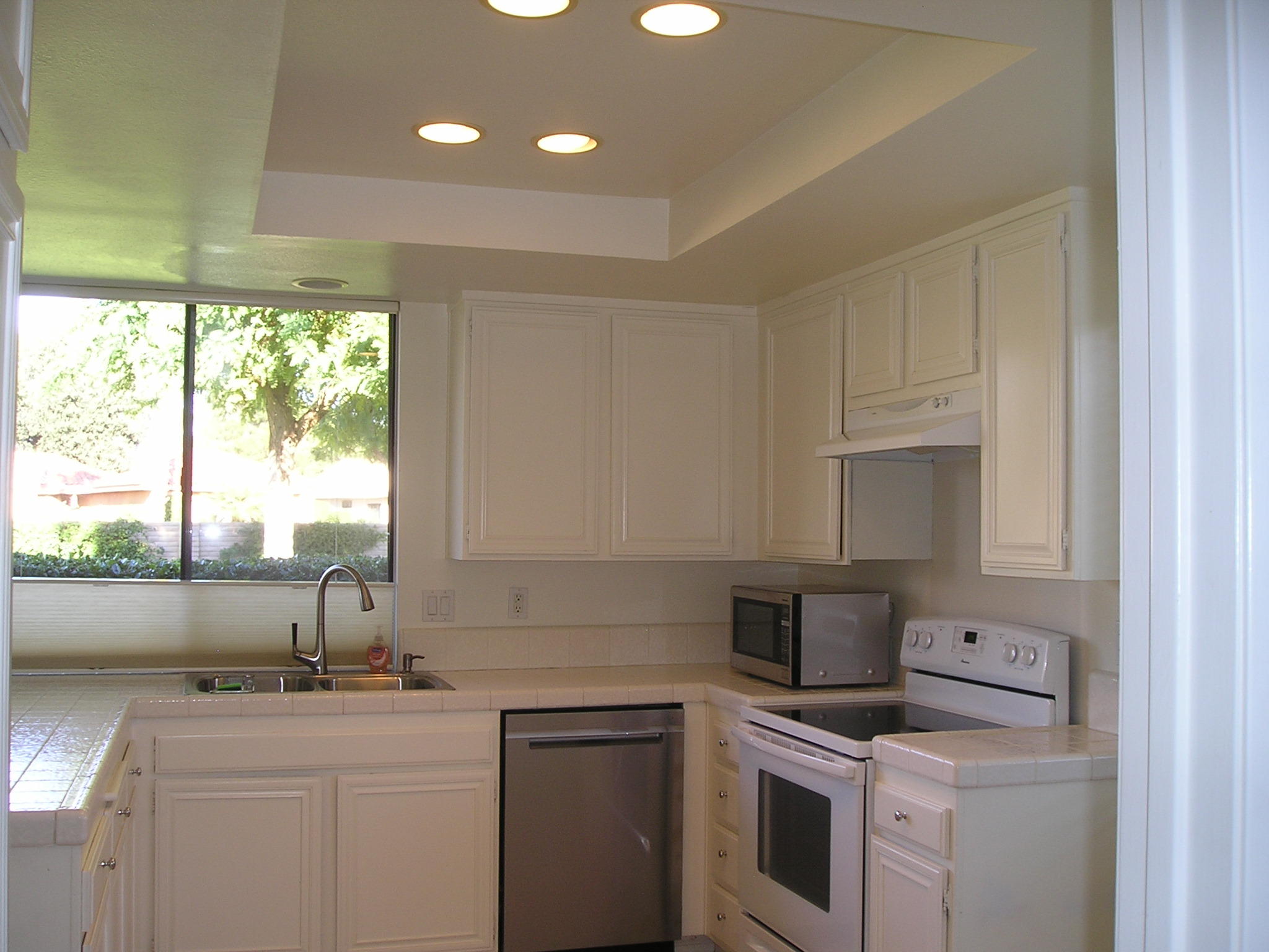 38 Malaga Drive Rancho Mirage, CA 92270 - Photo 9 of 37 a kitchen with a sink and cabinets