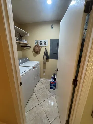 a utility room with sink dryer and washer