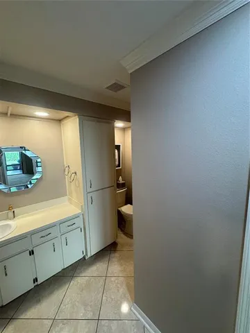 a bathroom with a sink a toilet and a tub