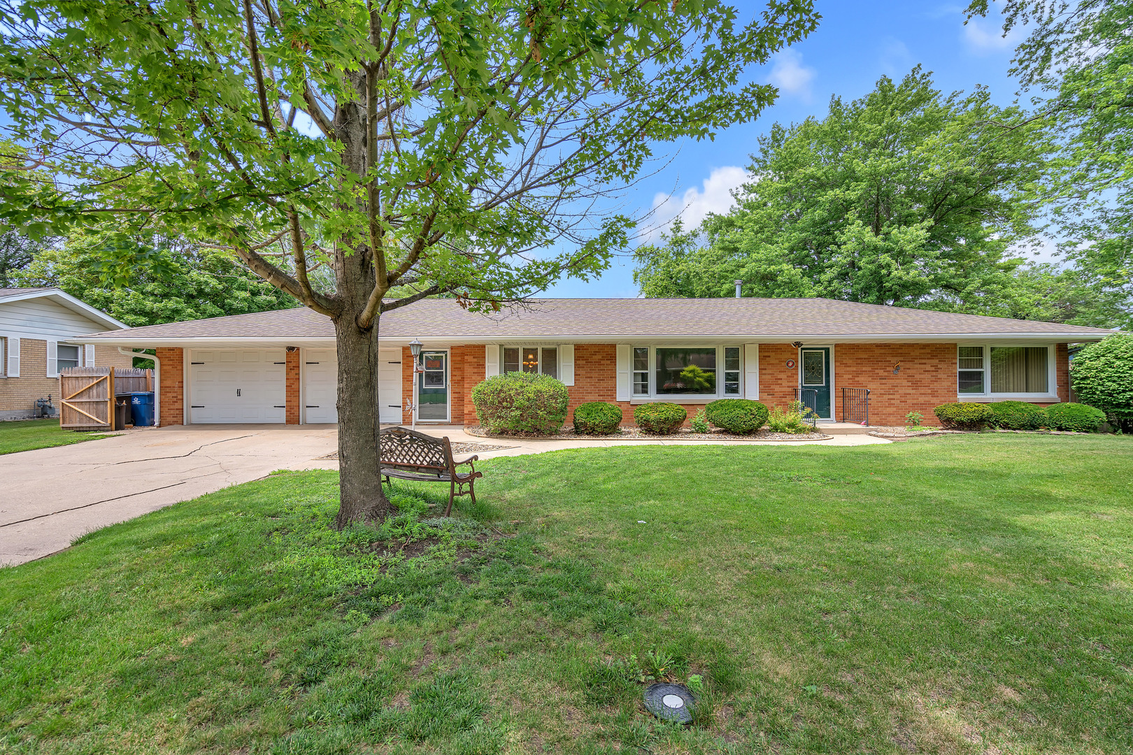 312 Wilmac Street Dwight, IL 60420 - Photo 1 of 26 a front view of house with a garden and trees