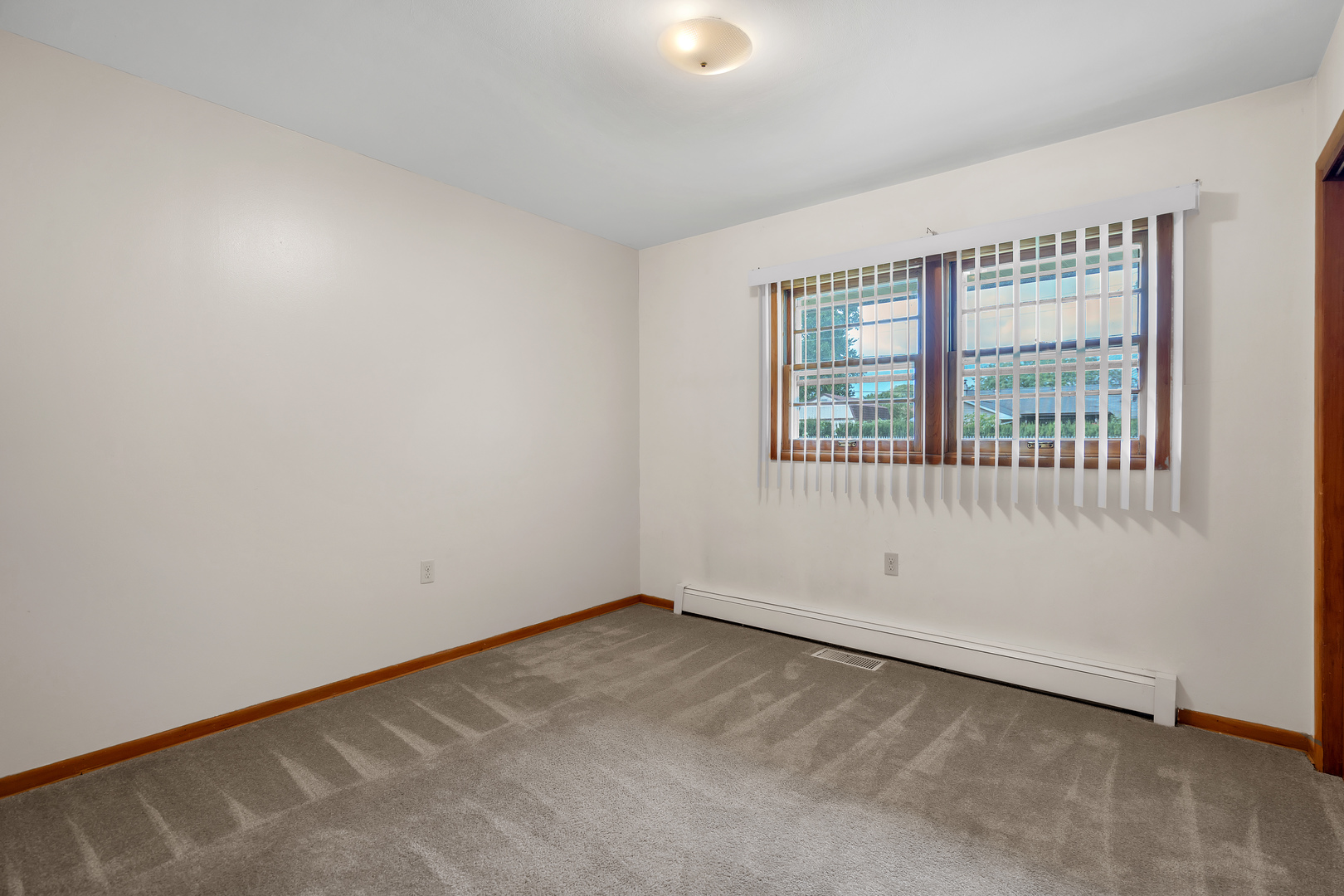 312 Wilmac Street Dwight, IL 60420 - Photo 12 of 26 an empty room with a window