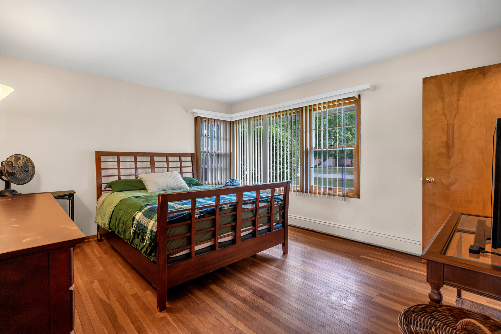 312 Wilmac Street Dwight, IL 60420 - Photo 13 of 26 a bedroom with a bed next to a window with wooden floor