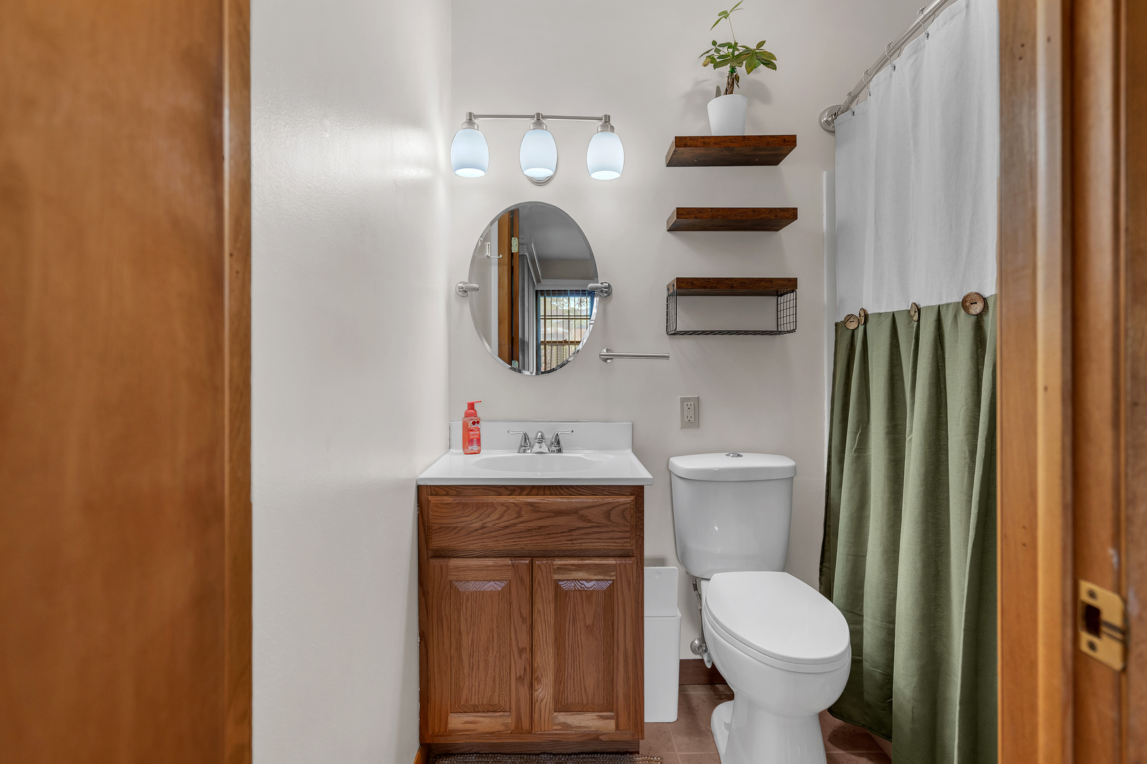 312 Wilmac Street Dwight, IL 60420 - Photo 15 of 26 a bathroom with a toilet a sink and a mirror