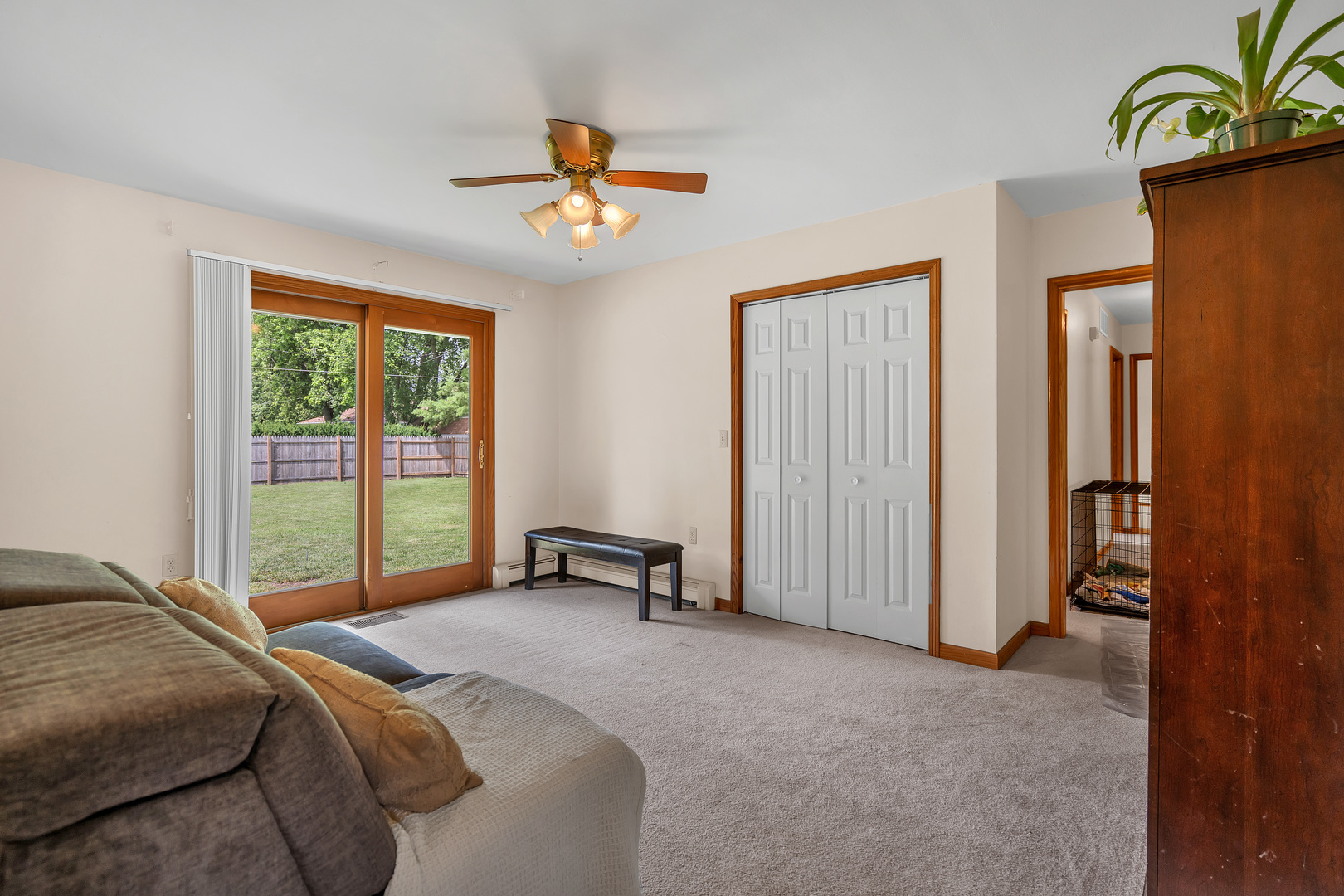 312 Wilmac Street Dwight, IL 60420 - Photo 8 of 26 a bedroom with a bed and a chandelier