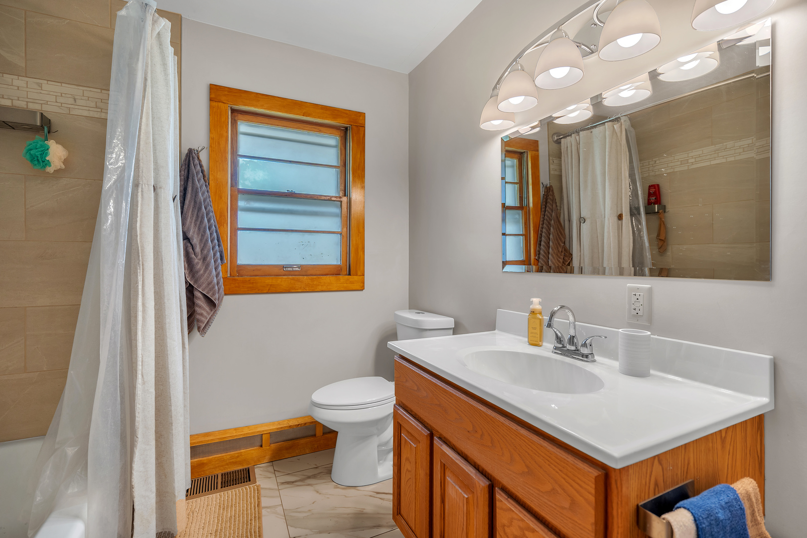 312 Wilmac Street Dwight, IL 60420 - Photo 10 of 26 a bathroom with a sink and a mirror