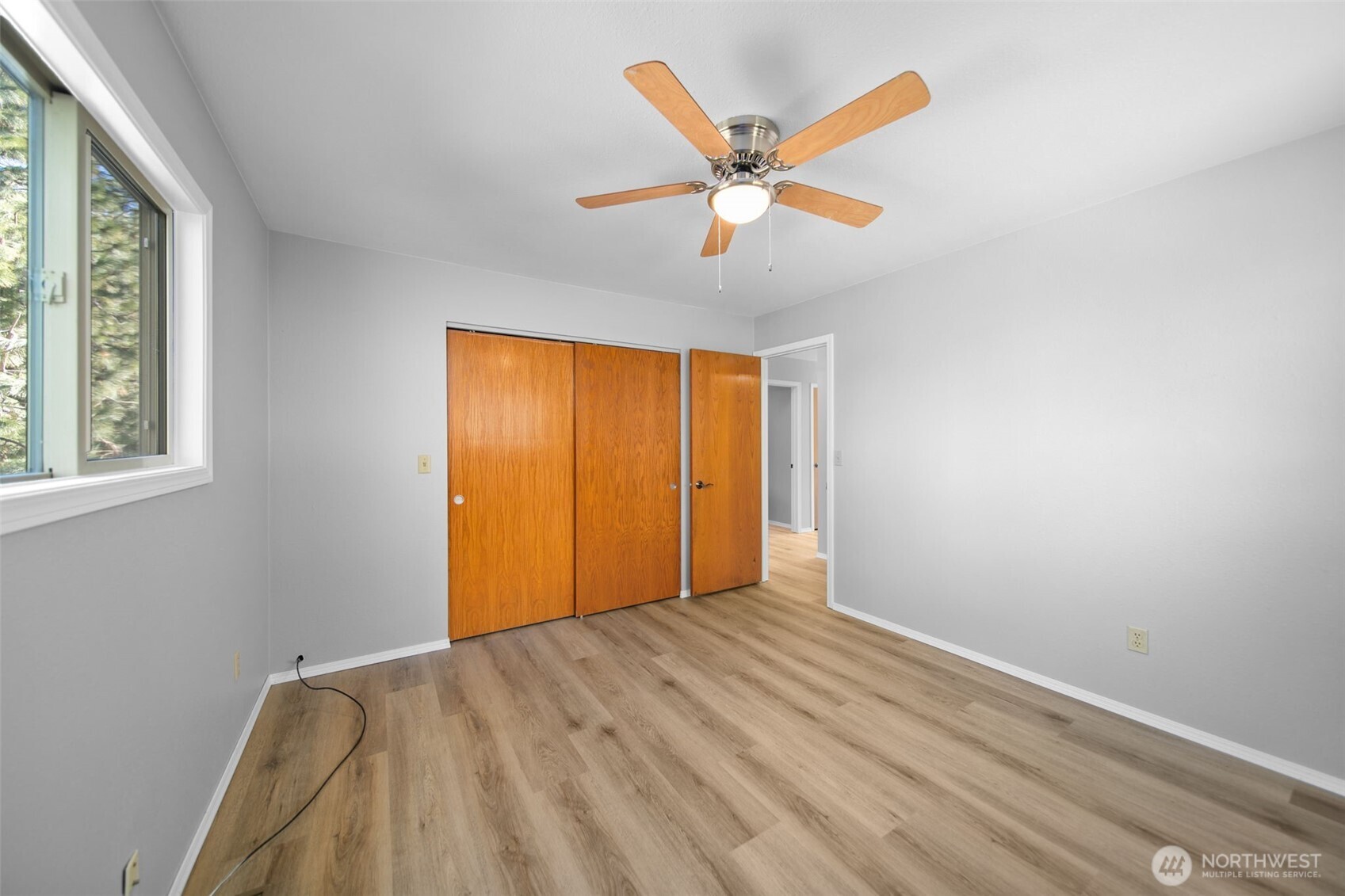 4195 Squilchuck Road Wenatchee, WA 98801 - Photo 14 of 39 a view of empty room with wooden floor and fan
