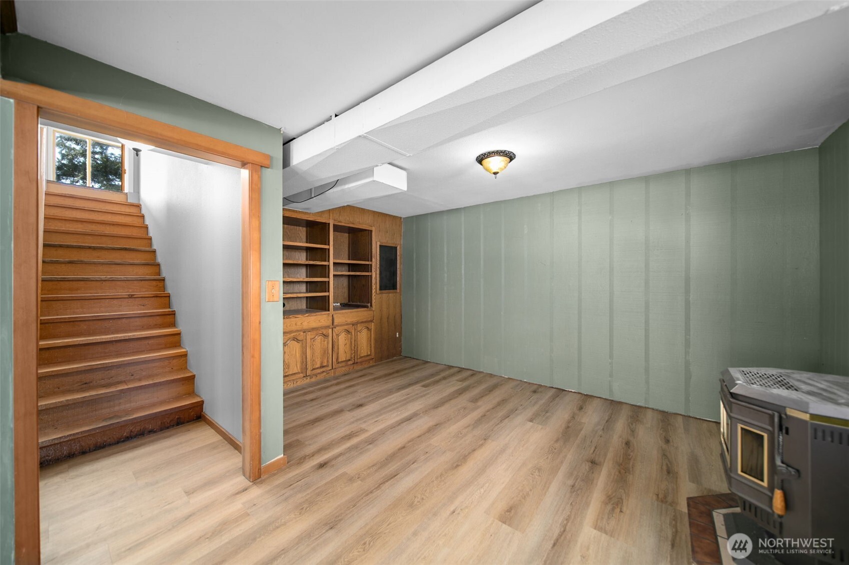 4195 Squilchuck Road Wenatchee, WA 98801 - Photo 16 of 39 a view of a livingroom with wooden floor and staircase