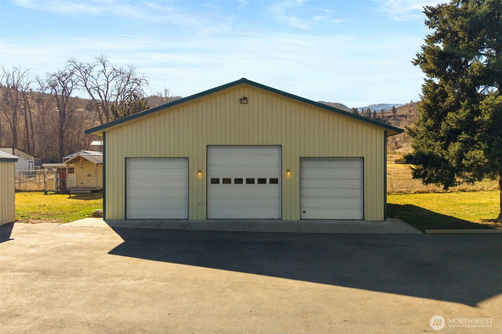 4195 Squilchuck Road Wenatchee, WA 98801 - Photo 23 of 39 a view of a house with backyard and trees
