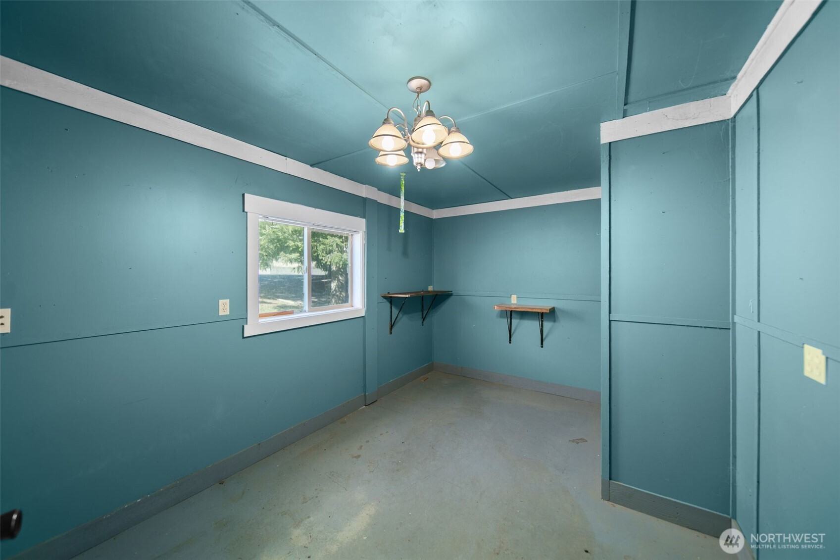 4195 Squilchuck Road Wenatchee, WA 98801 - Photo 26 of 39 a view of a chandelier fan and fire place