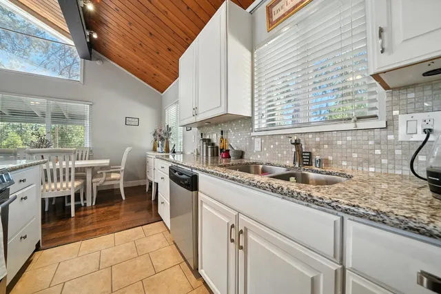 a bedroom with furniture and a chandelier