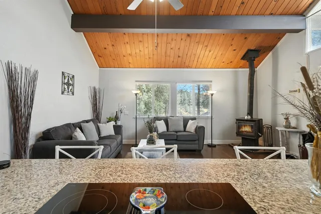 a living room with furniture gym equipment and a view of bedroom
