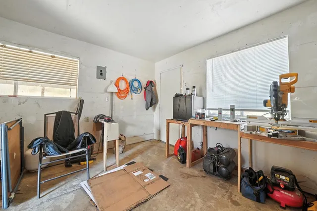 a view of a house with a tree in the background