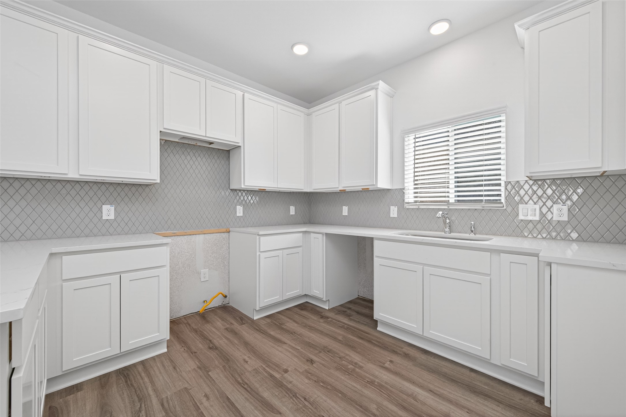 12359 Sunset Canyon Way Willis, TX 77318 - Photo 13 of 35 a kitchen with granite countertop white cabinets and a sink