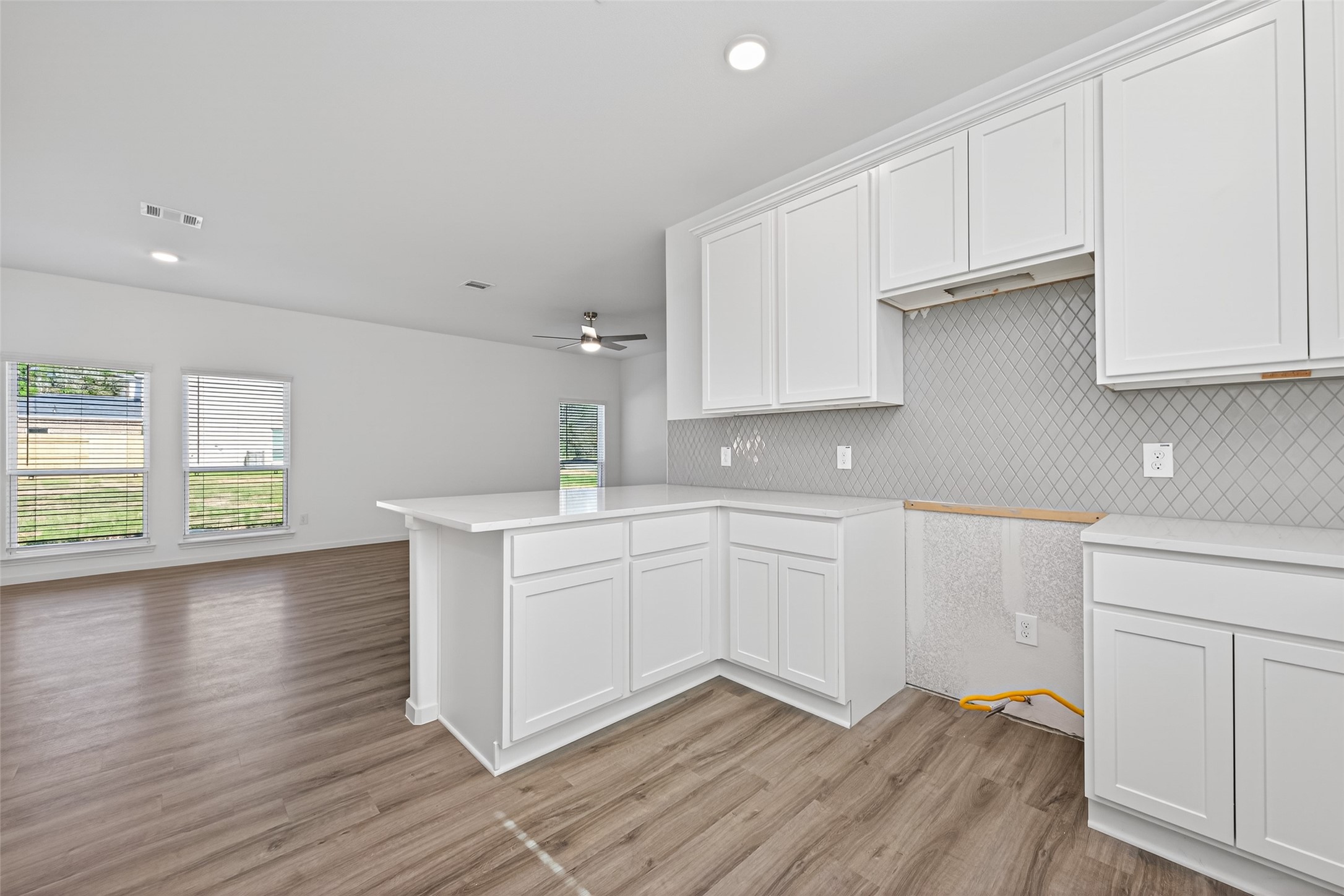 12359 Sunset Canyon Way Willis, TX 77318 - Photo 16 of 35 a kitchen with granite countertop white cabinets and white appliances