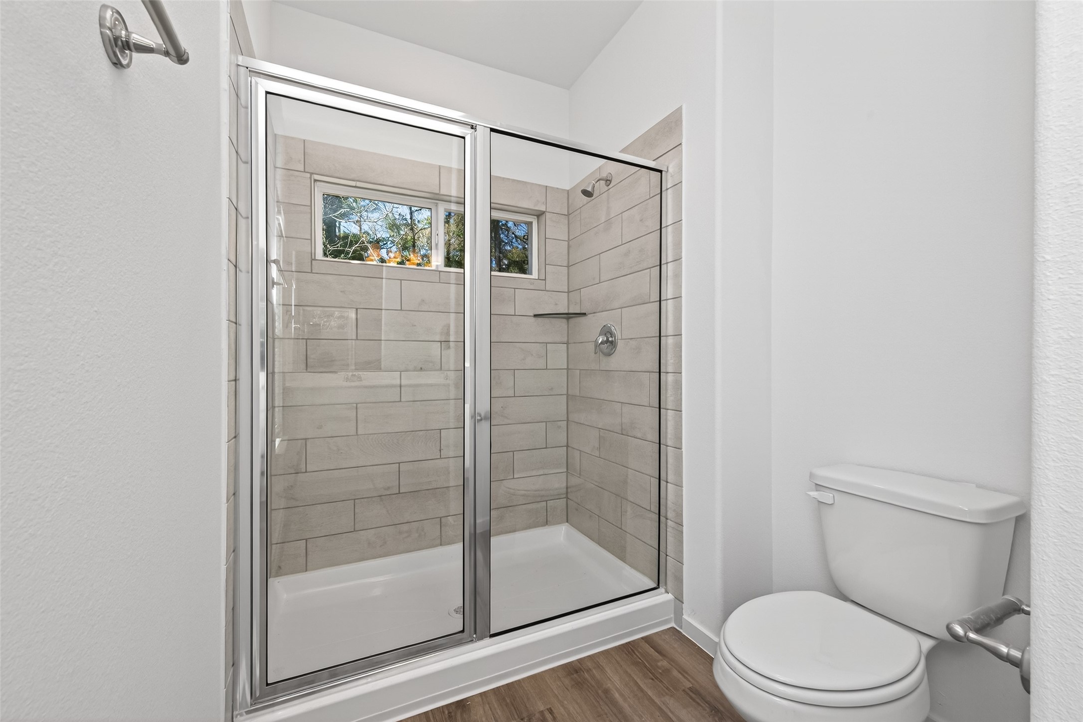 12359 Sunset Canyon Way Willis, TX 77318 - Photo 27 of 35 a bathroom with a toilet and a shower