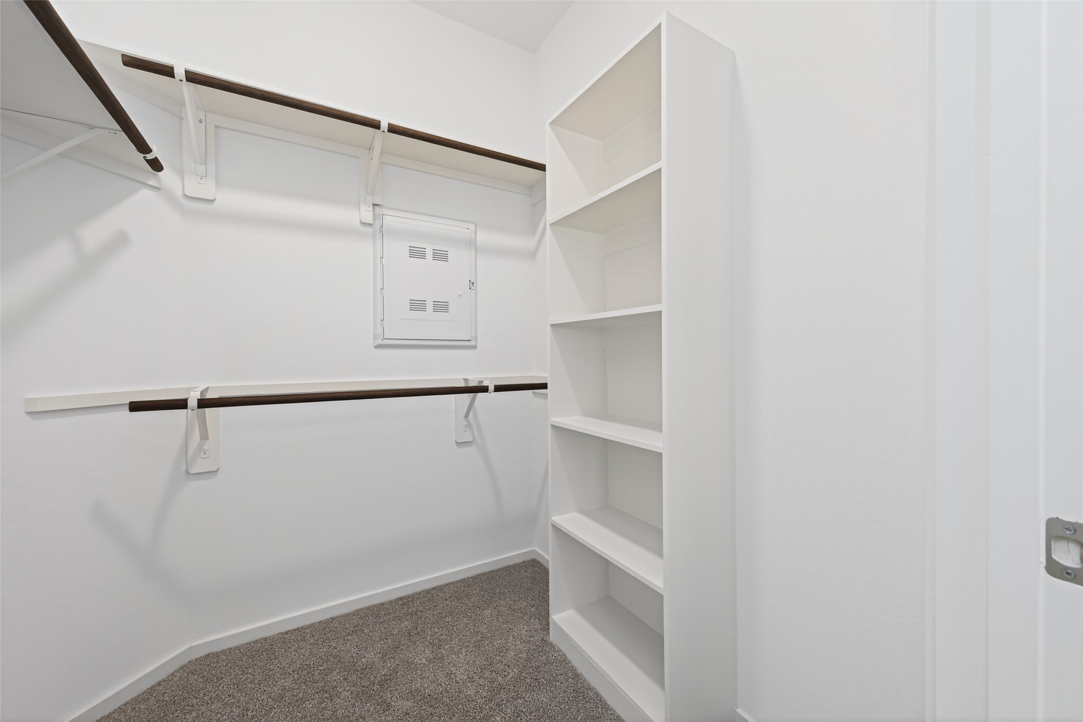 12359 Sunset Canyon Way Willis, TX 77318 - Photo 28 of 35 a view of walk in closet with empty racks