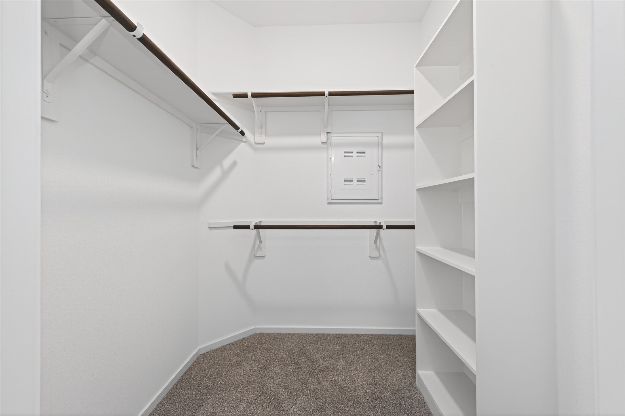 12359 Sunset Canyon Way Willis, TX 77318 - Photo 29 of 35 a view of walk in closet with empty racks