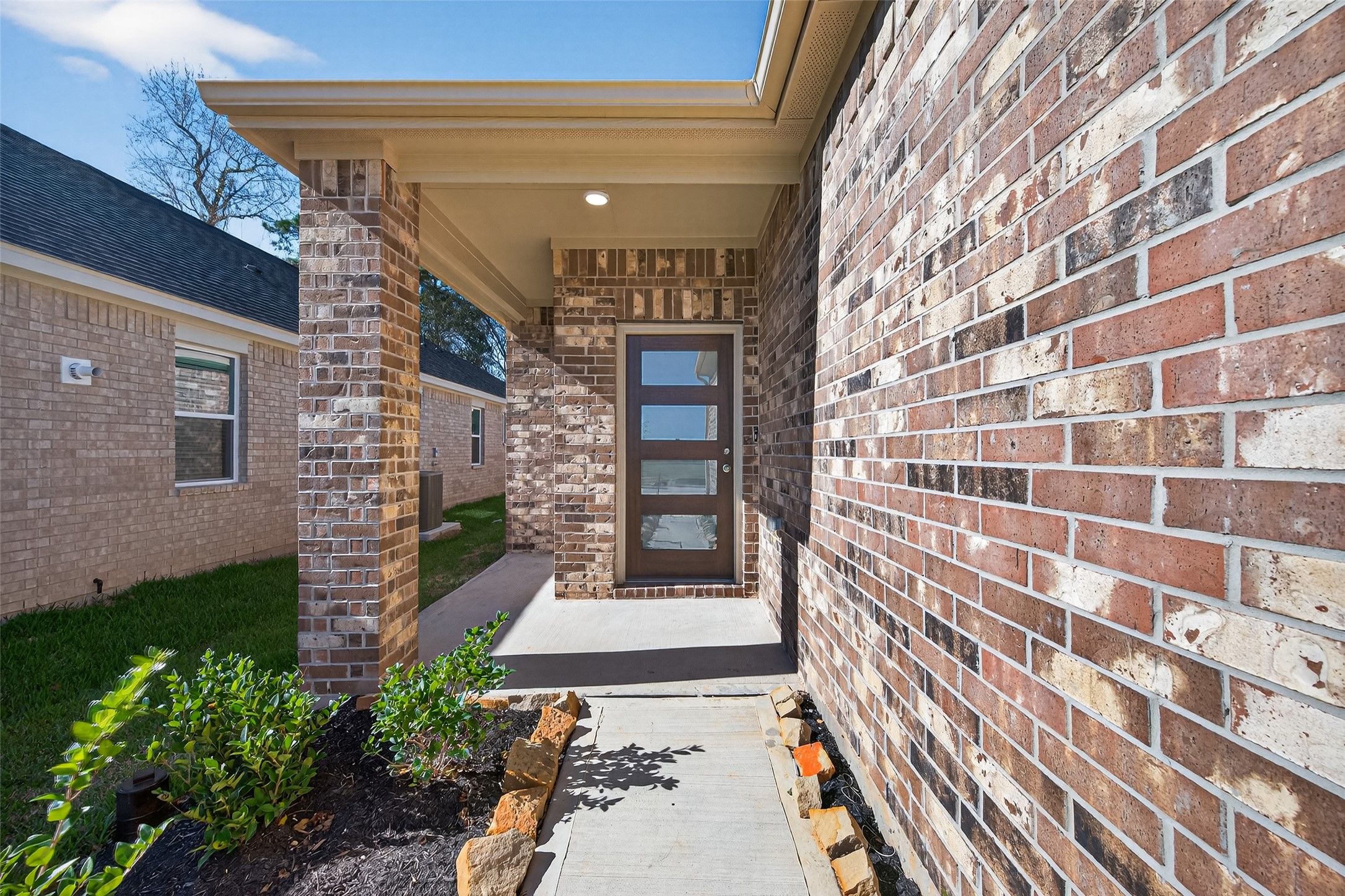12359 Sunset Canyon Way Willis, TX 77318 - Photo 4 of 35 a view of a brick buildings with entryway