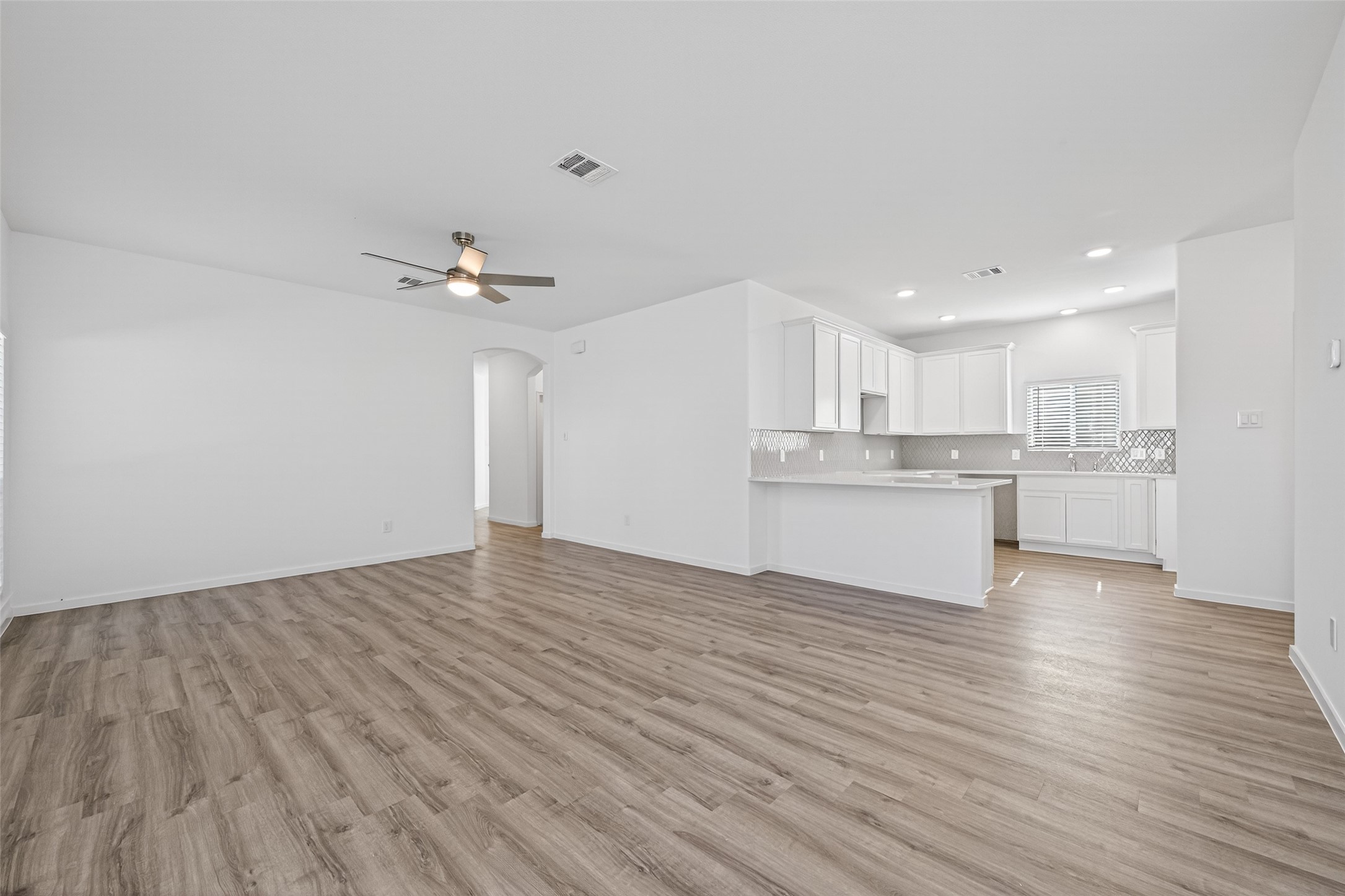 12359 Sunset Canyon Way Willis, TX 77318 - Photo 10 of 35 a view of kitchen with wooden floor and window