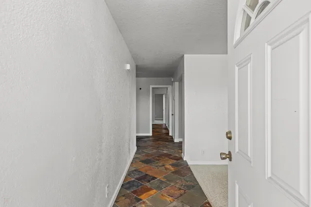 a view of a room with window and stairs