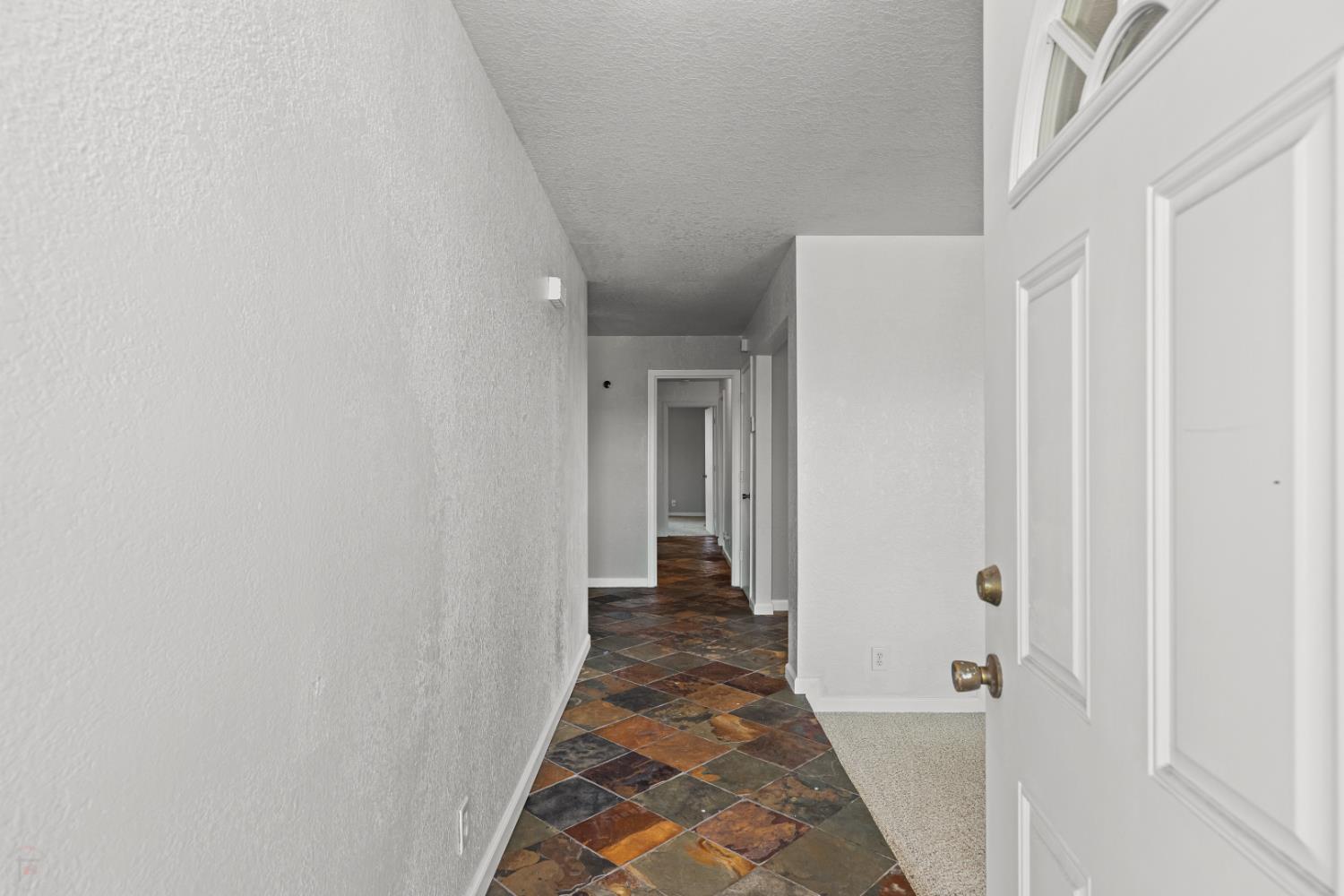 2512 Quail Hill Road Copperopolis, CA 95228 - Photo 14 of 70 a view of a hallway with hallway