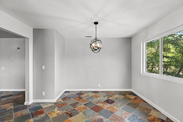 a kitchen with stainless steel appliances granite countertop a refrigerator sink and cabinets