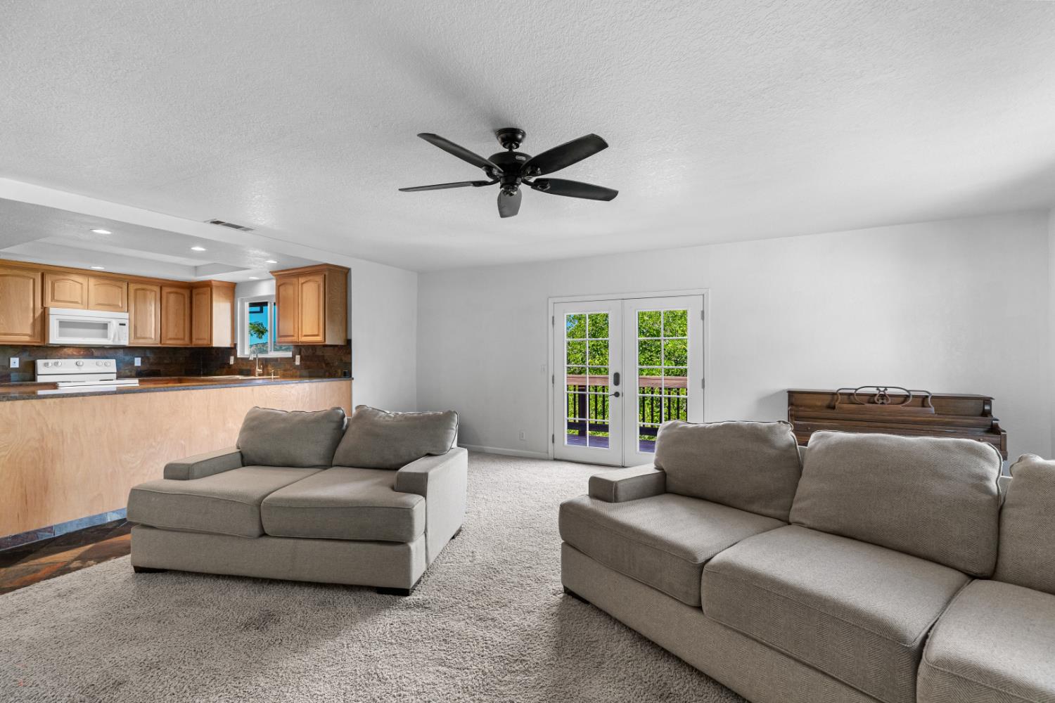 2512 Quail Hill Road Copperopolis, CA 95228 - Photo 35 of 70 a living room with furniture and a large window