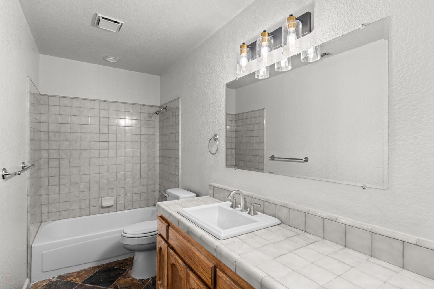 2512 Quail Hill Road Copperopolis, CA 95228 - Photo 38 of 70 a bathroom with a sink a toilet and shower