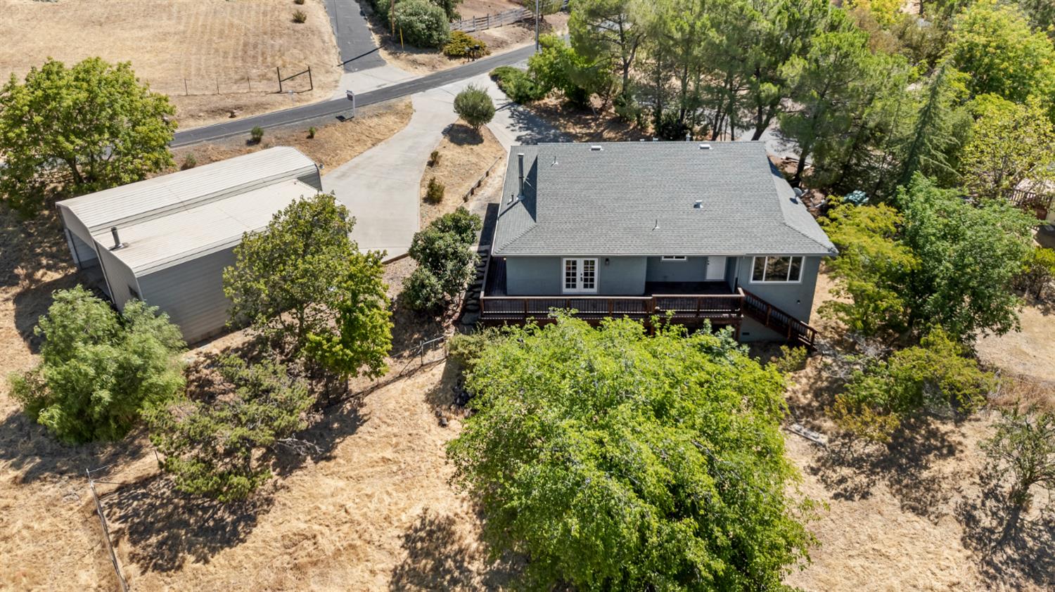 2512 Quail Hill Road Copperopolis, CA 95228 - Photo 4 of 70 an aerial view of a house with a yard and garden