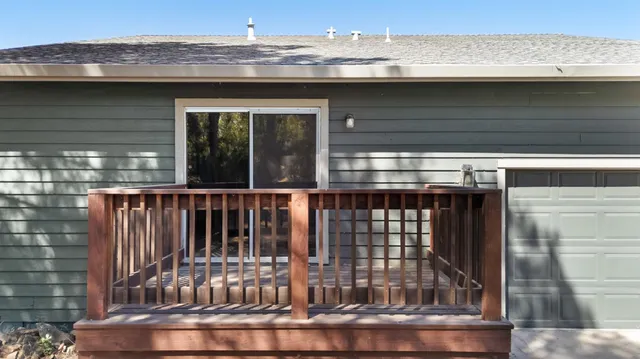 a view of white house with a snow on the road