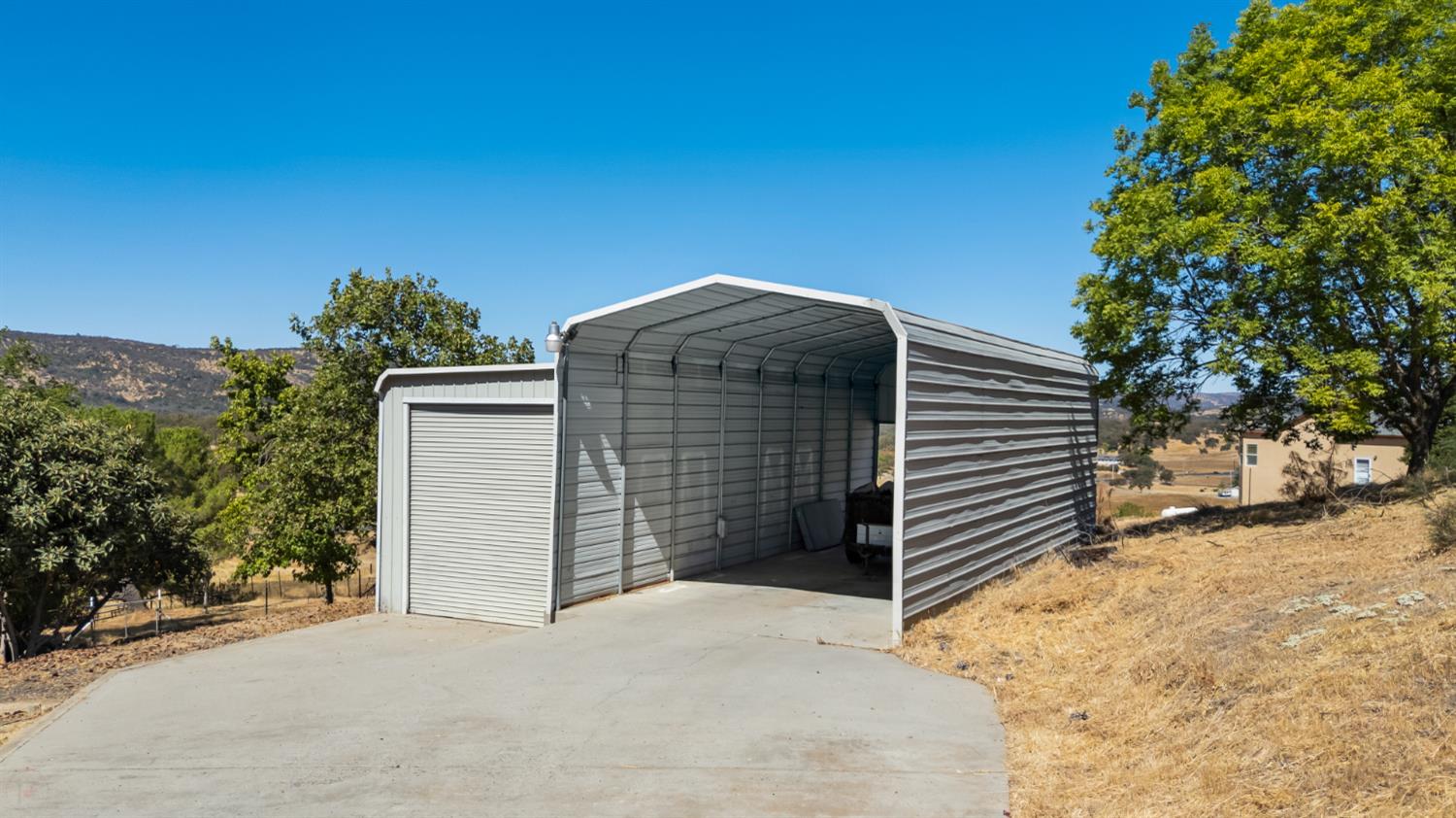2512 Quail Hill Road Copperopolis, CA 95228 - Photo 52 of 70 a view of a wooden door and a yard
