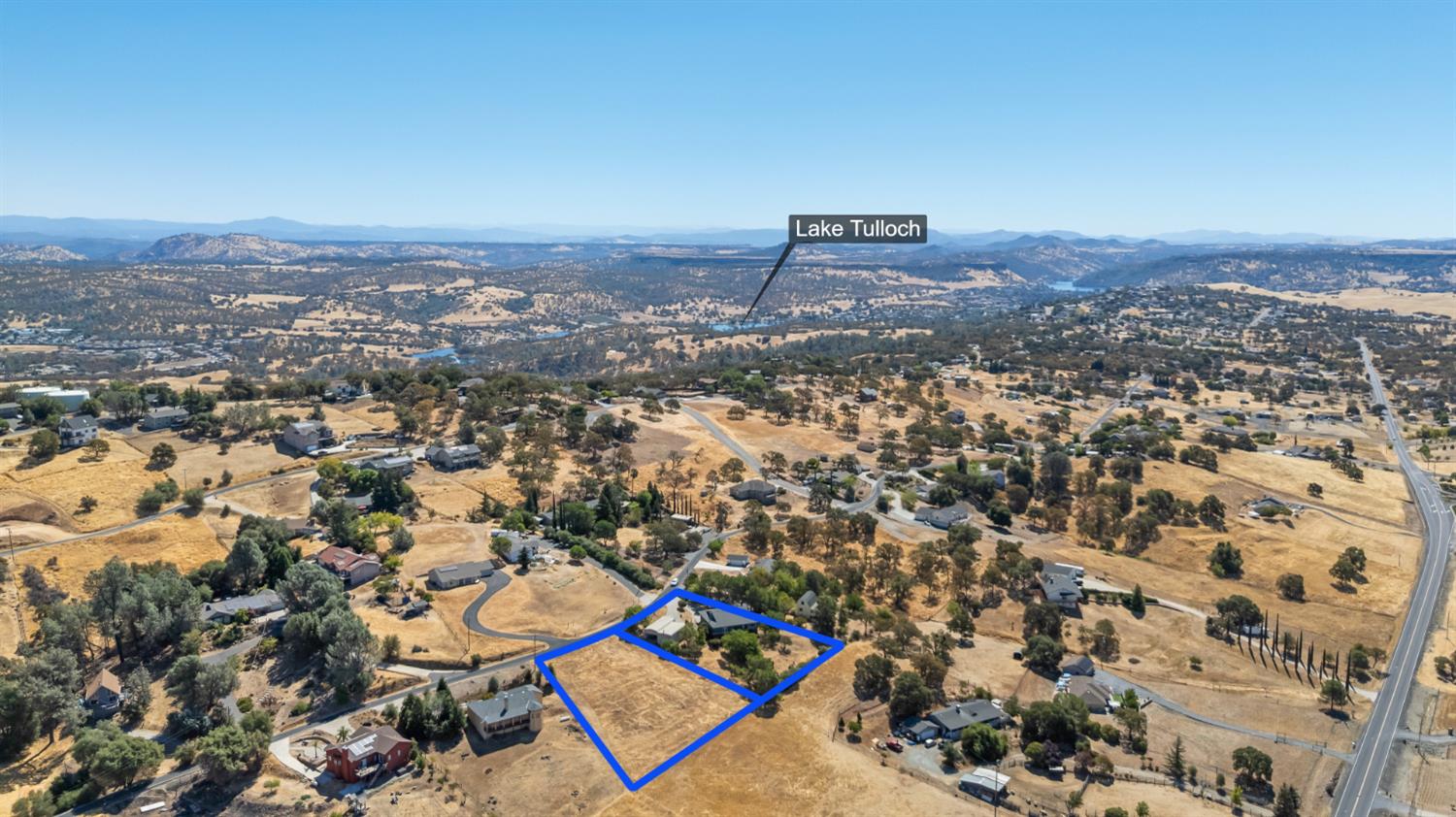 2512 Quail Hill Road Copperopolis, CA 95228 - Photo 63 of 70 an aerial view of residential house with yard and mountain view in back
