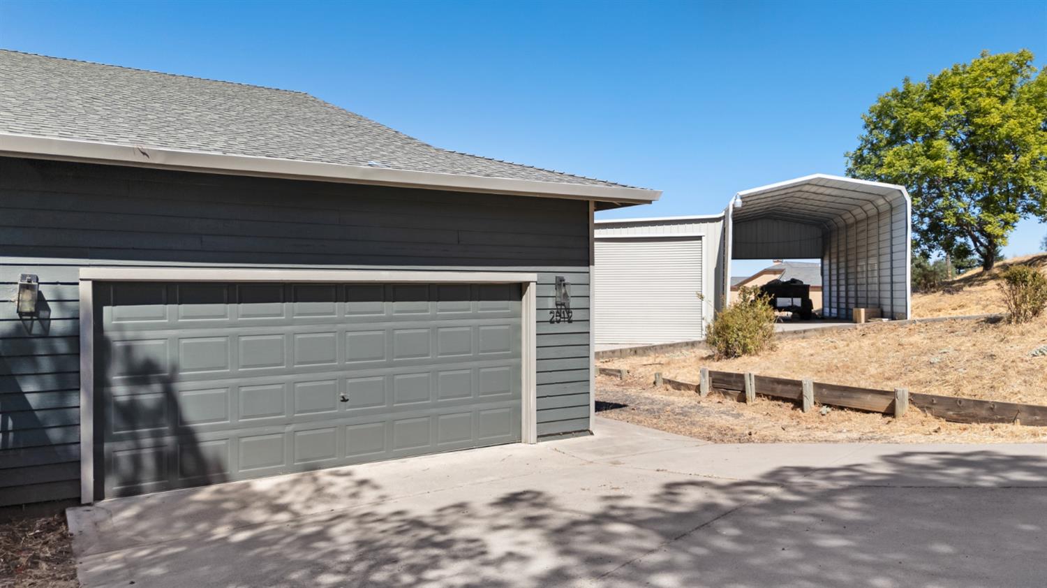 2512 Quail Hill Road Copperopolis, CA 95228 - Photo 7 of 70 a front view of a house with a yard