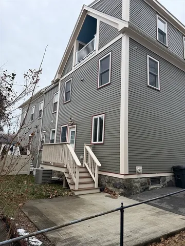 a front view of a house with stairs