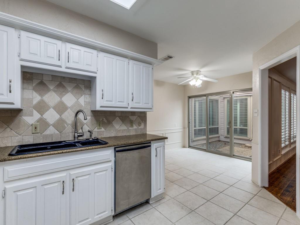 4020 Morman Lane Addison, TX 75001 - Photo 11 of 31 a kitchen with granite countertop a sink and cabinets