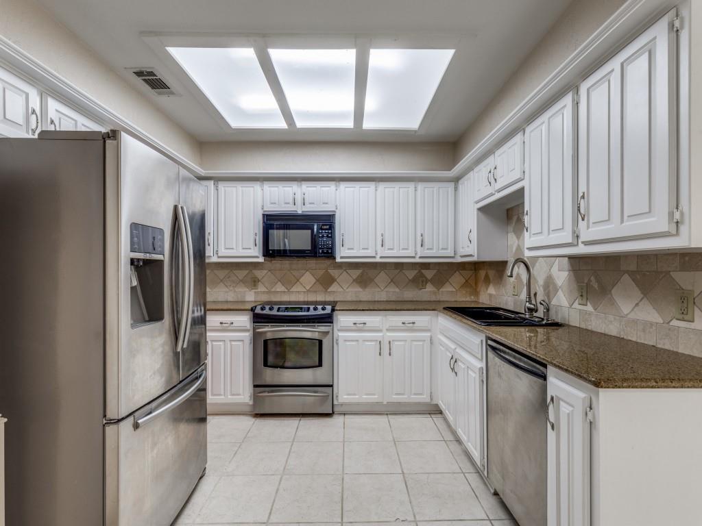 4020 Morman Lane Addison, TX 75001 - Photo 13 of 31 a kitchen with stainless steel appliances granite countertop a refrigerator sink and cabinets