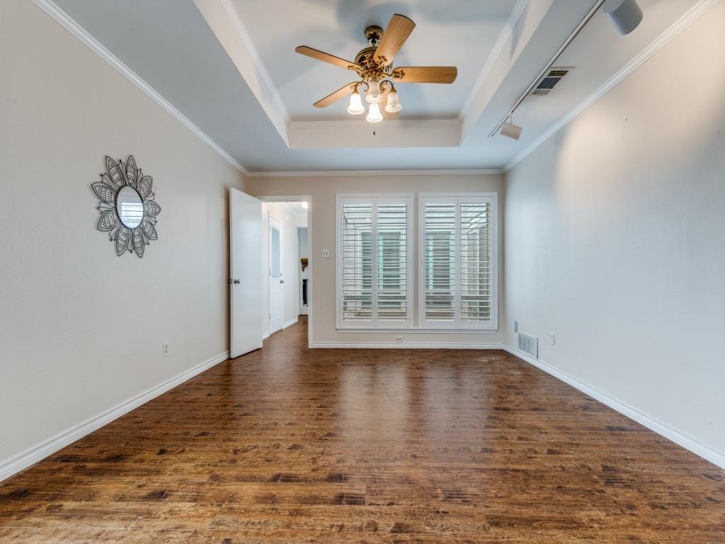 4020 Morman Lane Addison, TX 75001 - Photo 16 of 31 a view of an empty room with a window and wooden floor