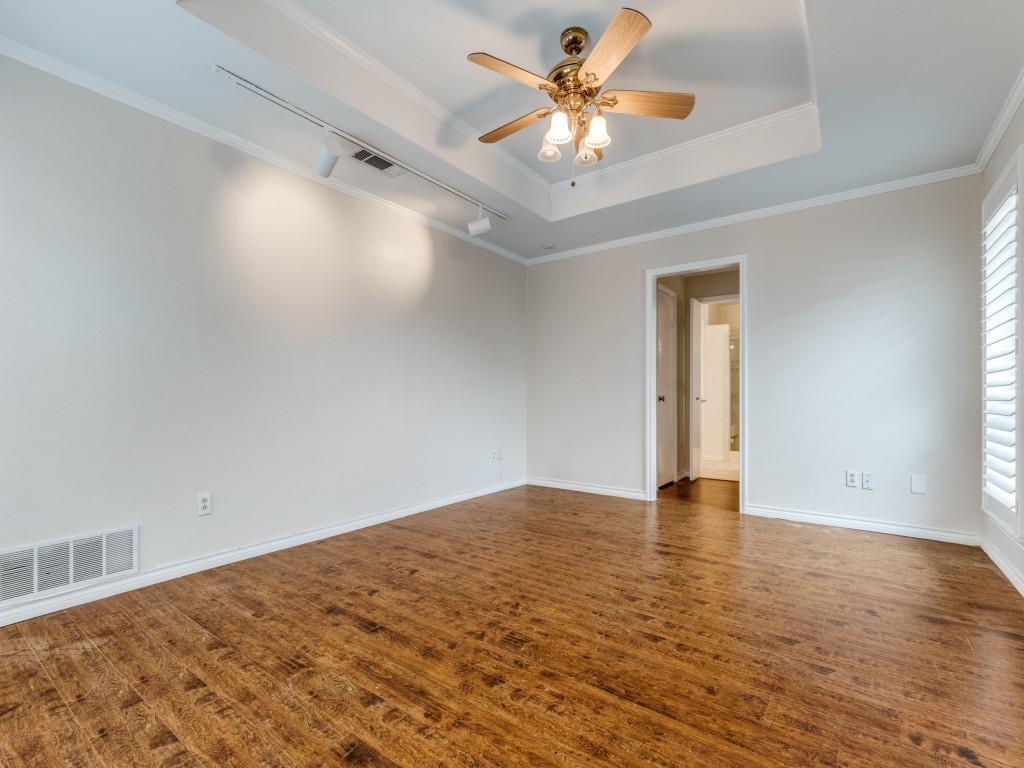 4020 Morman Lane Addison, TX 75001 - Photo 17 of 31 an empty room with wooden floor and a window