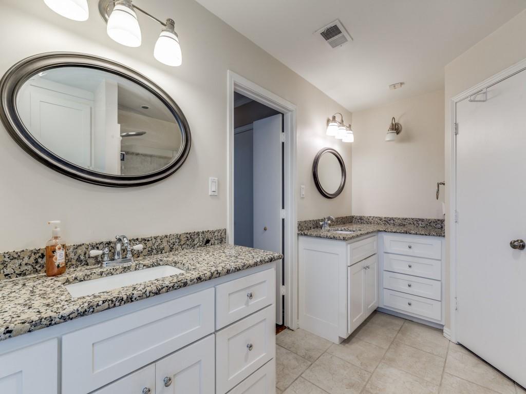 4020 Morman Lane Addison, TX 75001 - Photo 20 of 31 a bathroom with a granite countertop sink and mirror