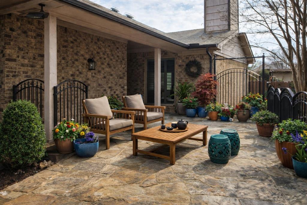 4020 Morman Lane Addison, TX 75001 - Photo 2 of 31 a building outdoor space with patio furniture and potted plants