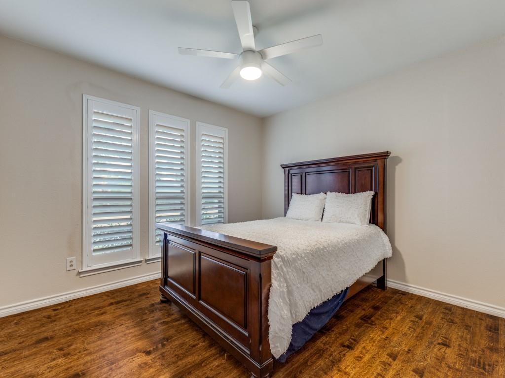 4020 Morman Lane Addison, TX 75001 - Photo 21 of 31 a bed sitting in a bedroom next to a window