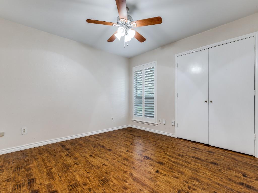4020 Morman Lane Addison, TX 75001 - Photo 22 of 31 a view of an empty room with chandelier fan and wooden floor