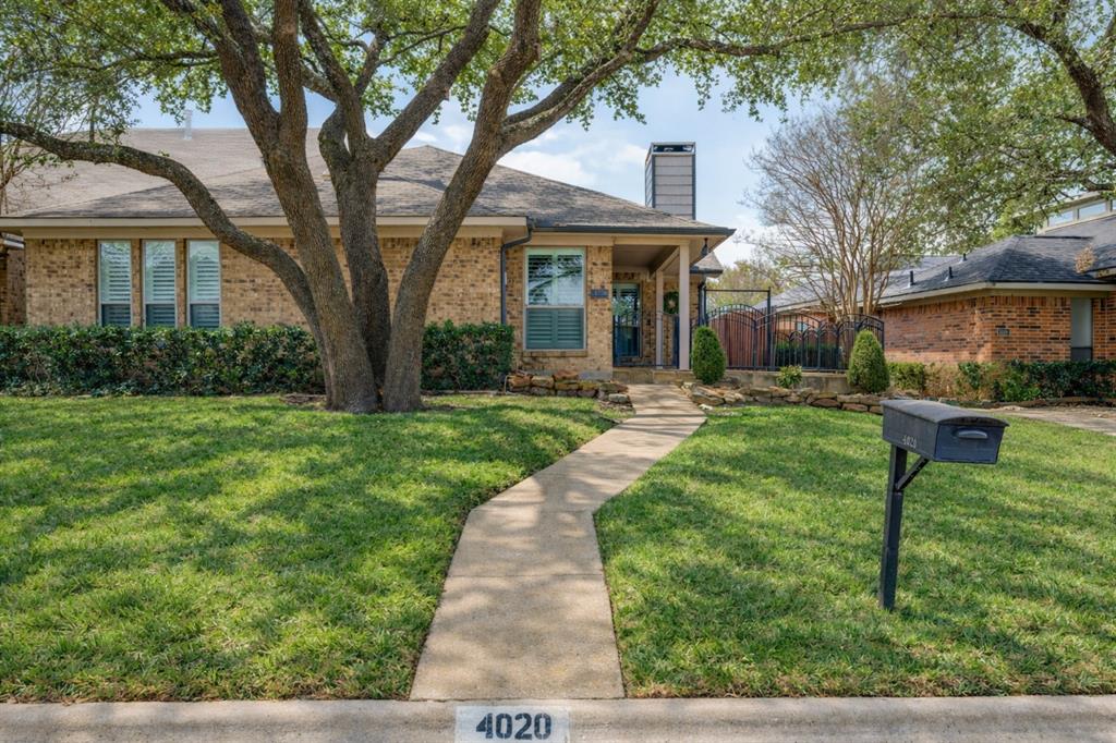 4020 Morman Lane Addison, TX 75001 - Photo 25 of 31 a front view of a house with yard and green space