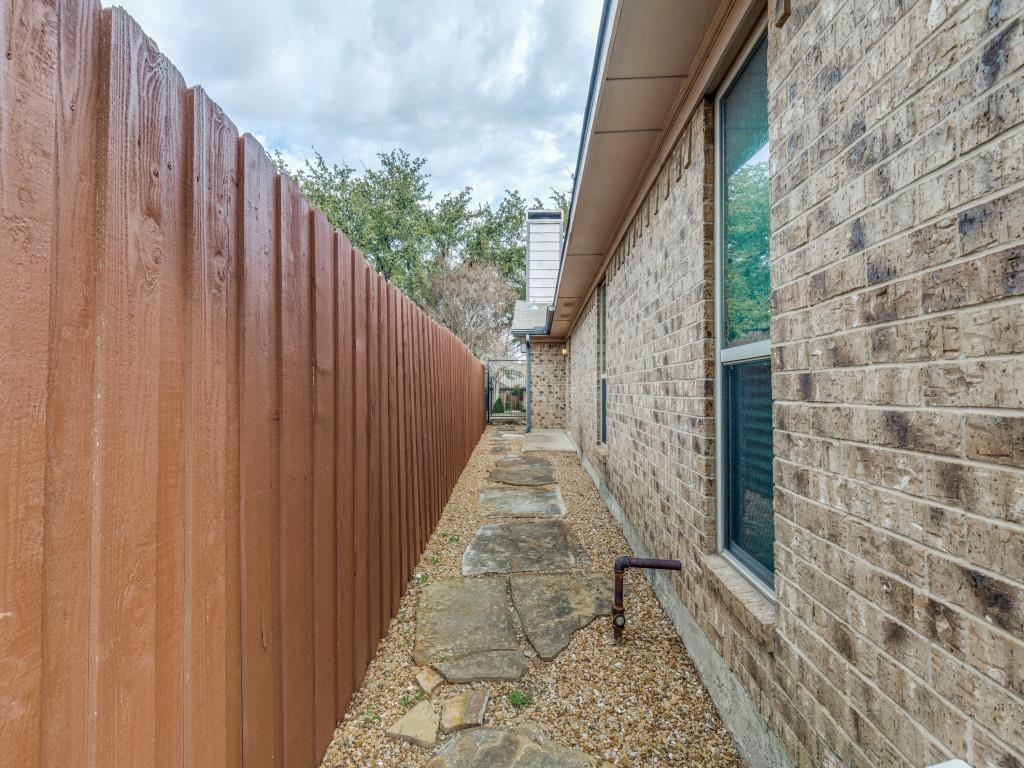 4020 Morman Lane Addison, TX 75001 - Photo 31 of 31 a view of a pathway with a wooden fence