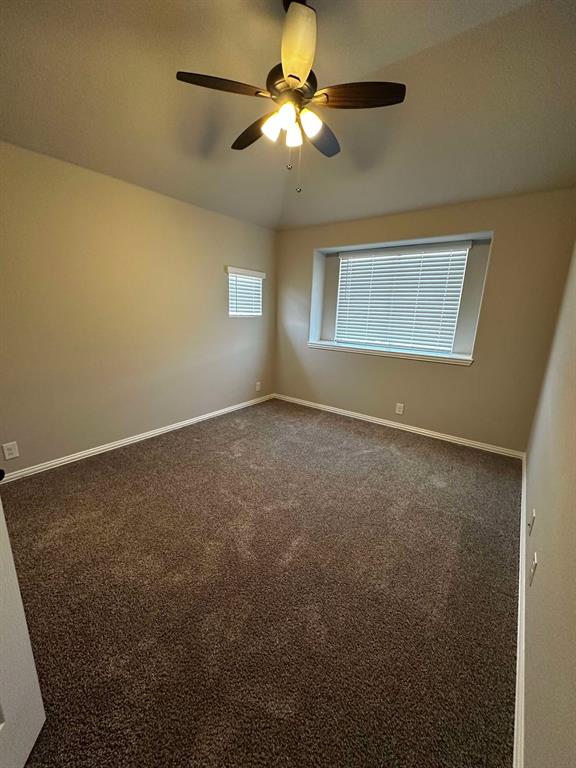 1217 Timber Grove Terrace Little Elm, TX 76227 - Photo 12 of 19 a view of an empty room and chandelier fan