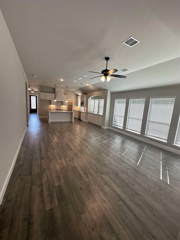1217 Timber Grove Terrace Little Elm, TX 76227 - Photo 4 of 19 a view of a livingroom with wooden floor and furniture