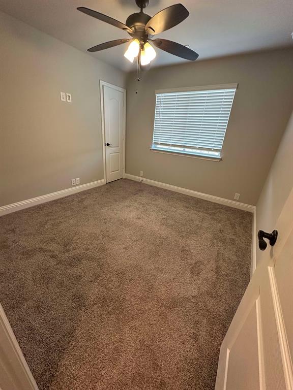 1217 Timber Grove Terrace Little Elm, TX 76227 - Photo 9 of 19 a view of an empty room with a window