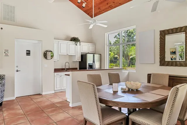 a view of a dining room with furniture and a window