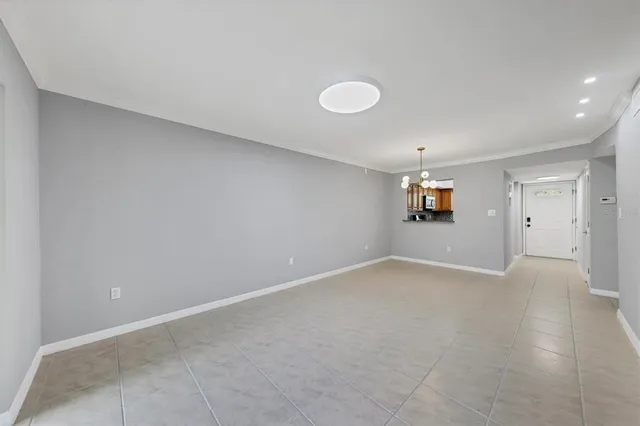 a view of an empty room and a window